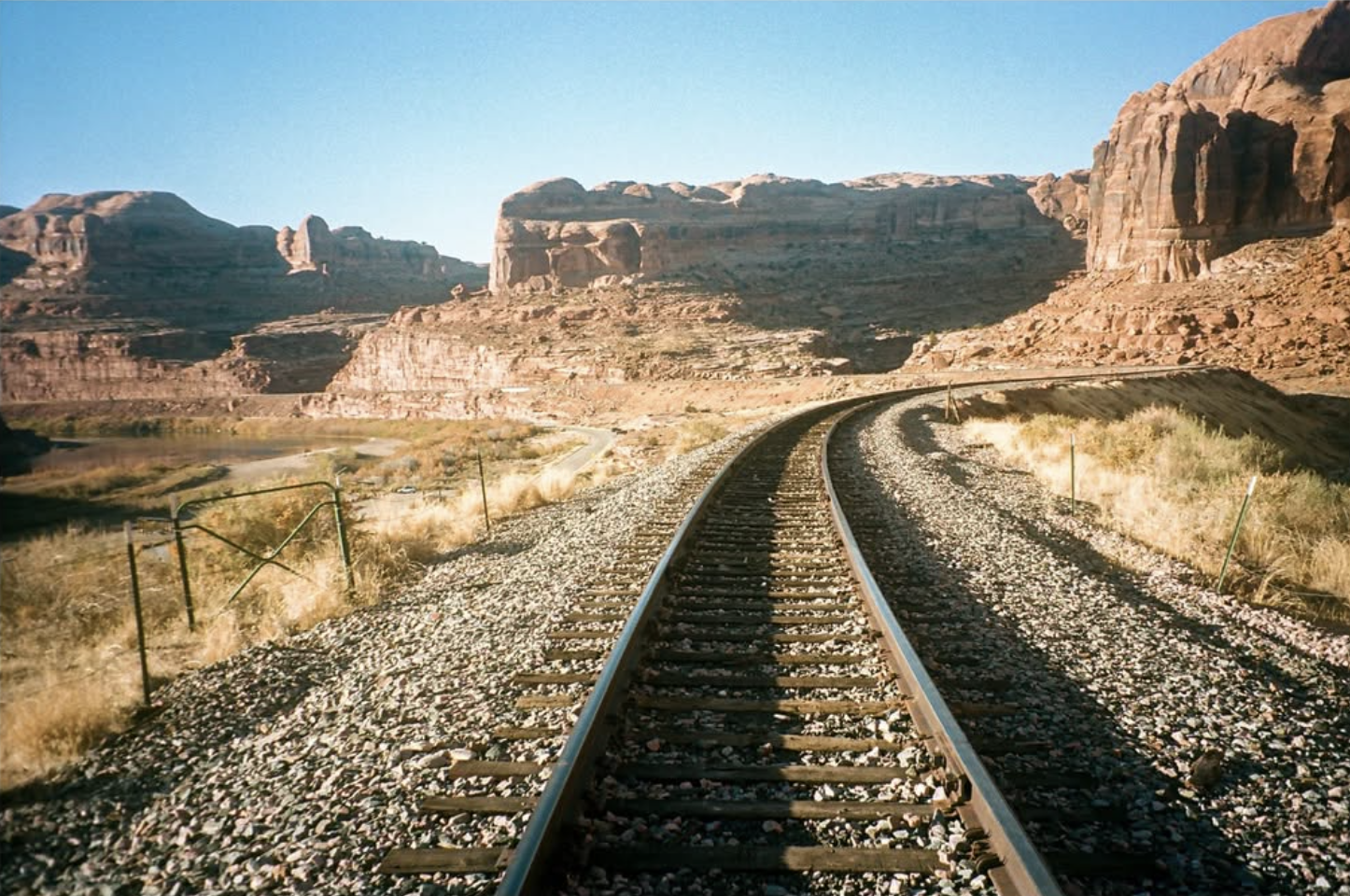 Railroad tracks through canyon